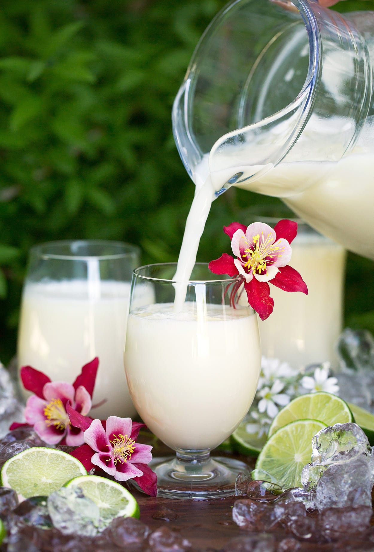 Brazilian limeade being poured into cups