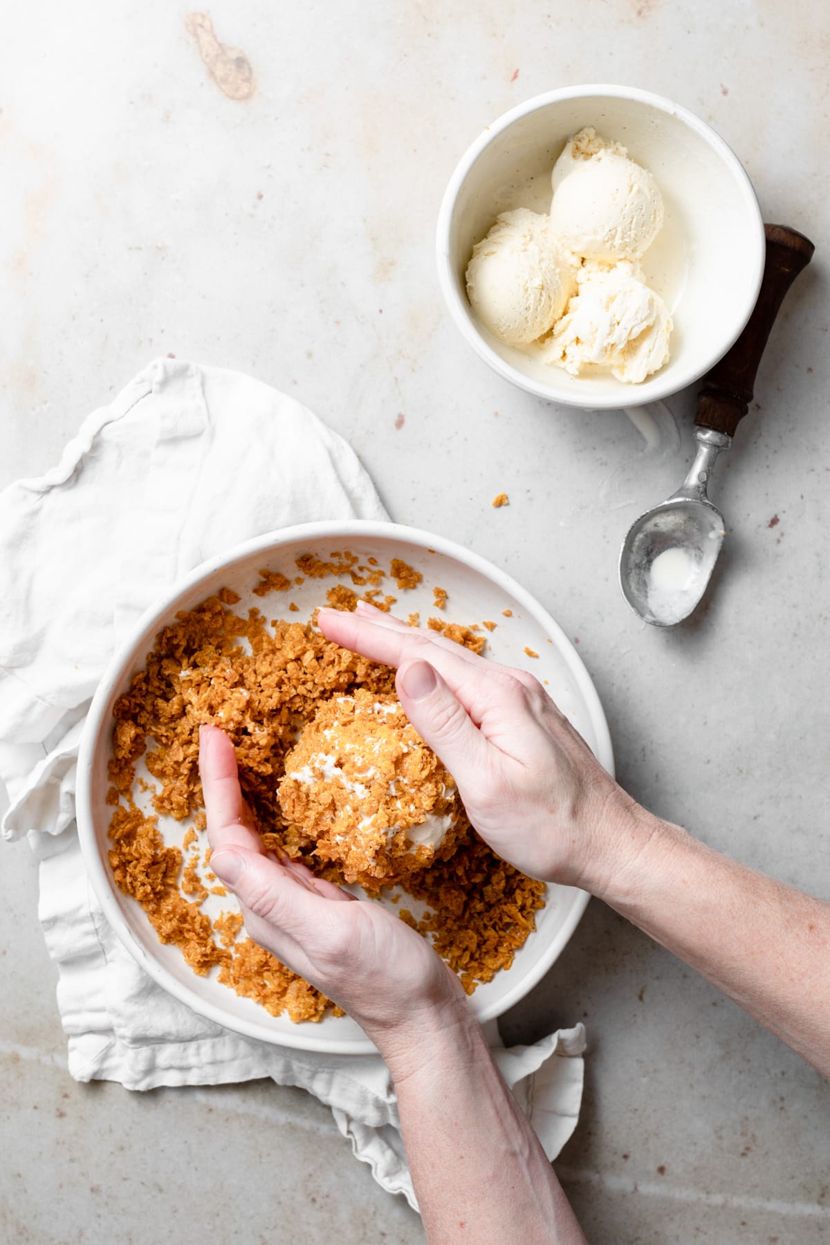 BEST EVER Easy Fried Ice Cream! Showing how to make fried ice cream, rolling a ball of ice cream in a cinnamon butter cornflake mixture.