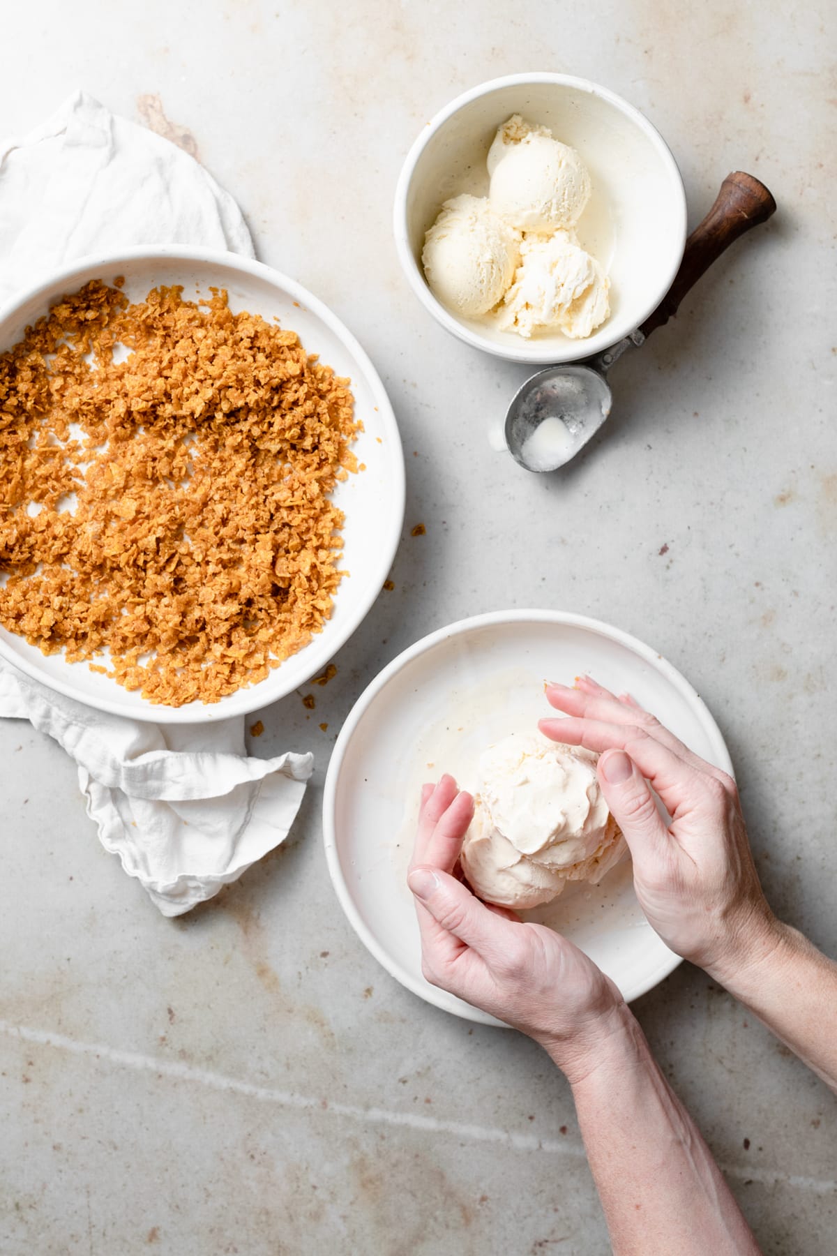 BEST EVER Easy Fried Ice Cream! Rolling vanilla ice cream into a ball on a plate.