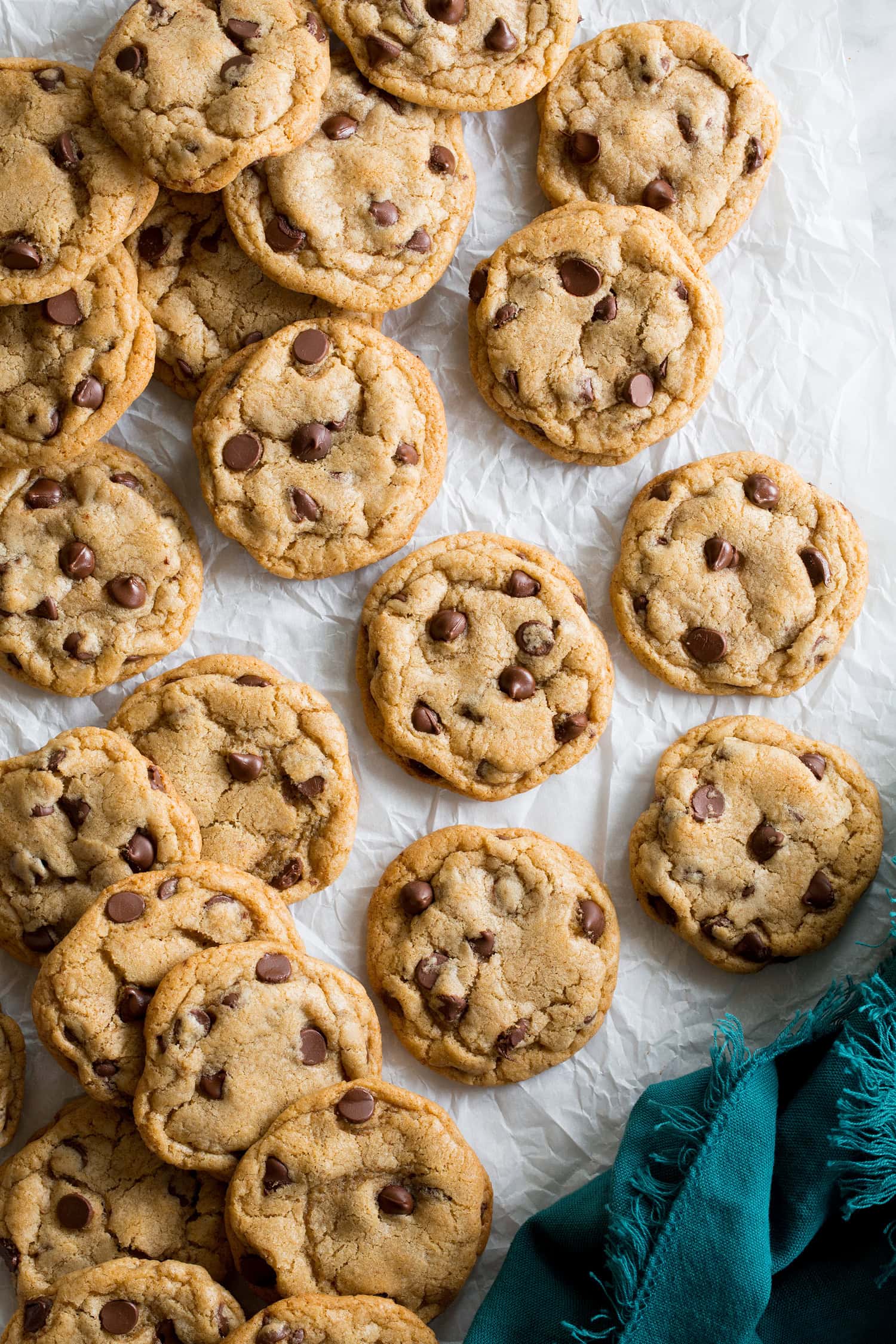 Browned Butter Chocolate Chip Cookies Completed browned butter chocolate chip cookies shown from above on parchment paper.