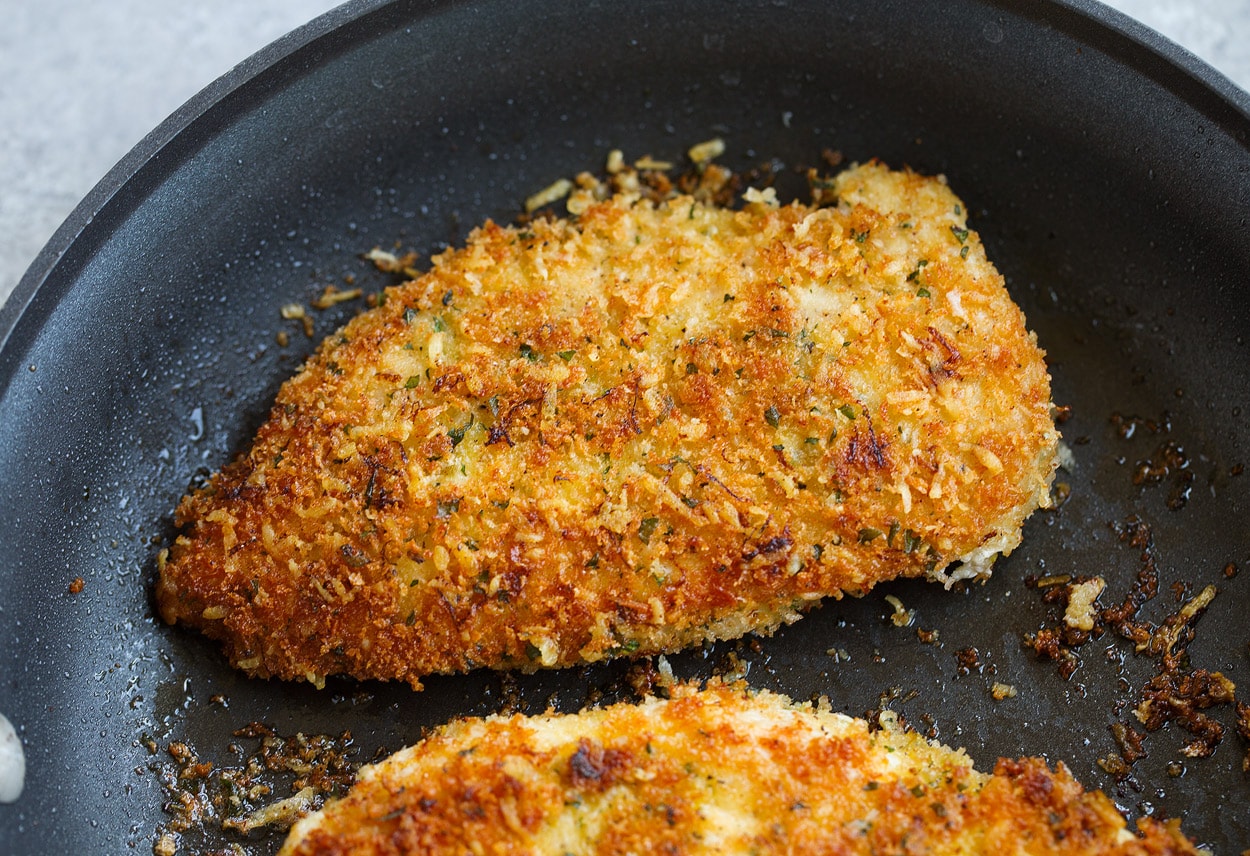 sauteeing chicken in skillet for lemon chicken romano