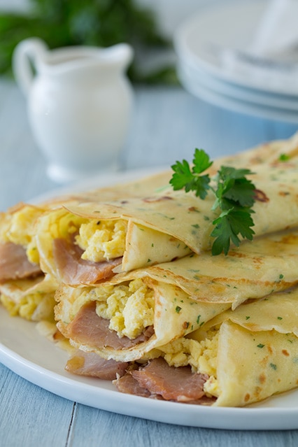 herb crepes with eggs, swiss, ham and browned butter