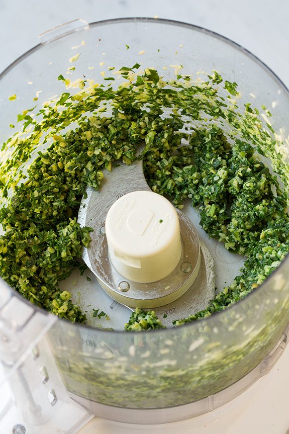 making homemade pesto in food processor