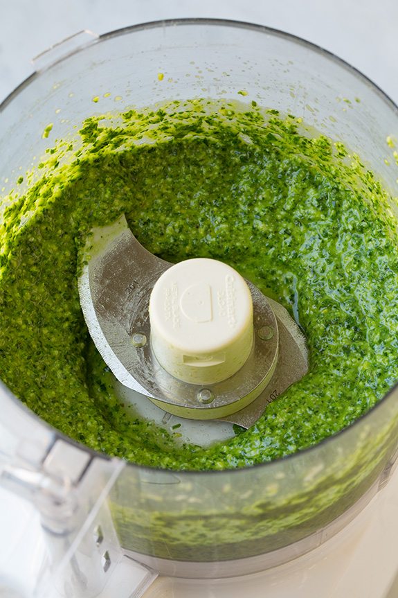 finished Basil Pesto in bowl of food processor
