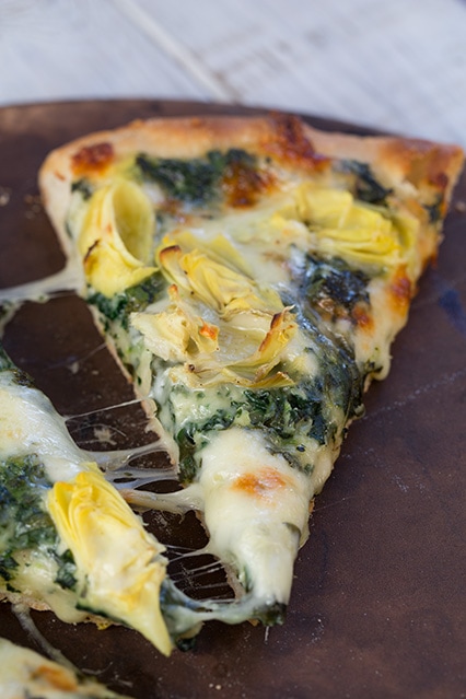 Melted Cheesy Spinach Artichoke Pizza slice