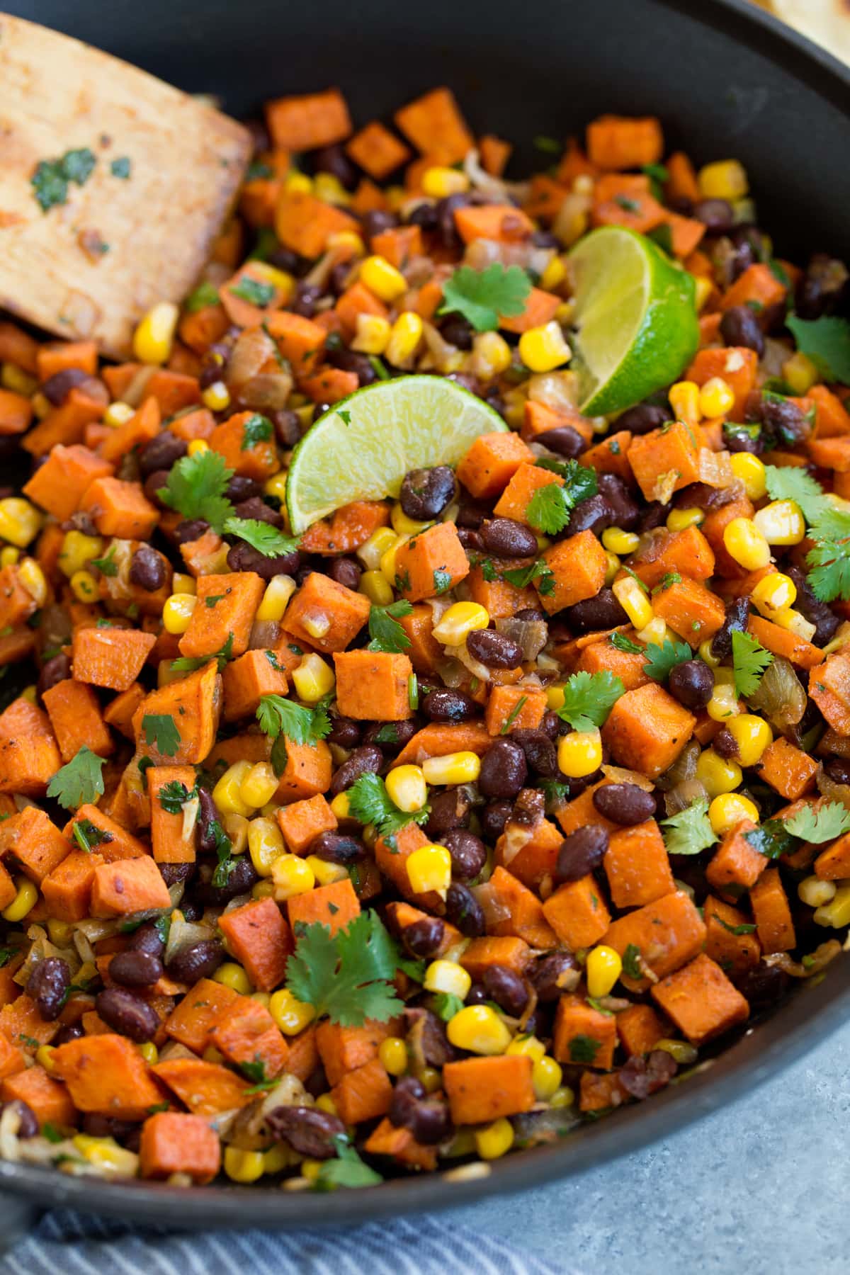 Sweet Potato and Black Bean Tacos Healthy vegetarian taco filling mixture in skillet.