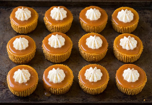 Mini Pumpkin Cheesecakes Twelve mini pumpkin cheesecakes.