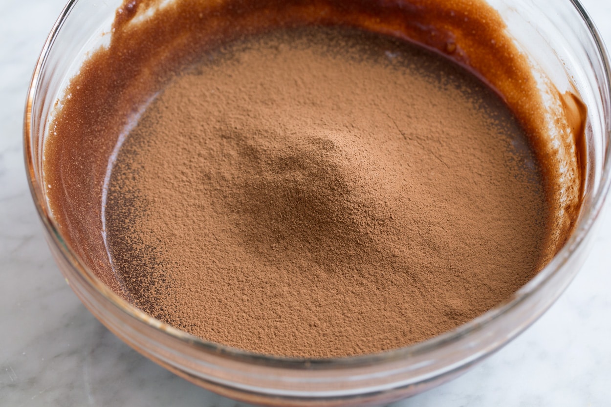 The BEST Flourless Chocolate Cake! Sifting cocoa powder into flourless chocolate cake batter.
