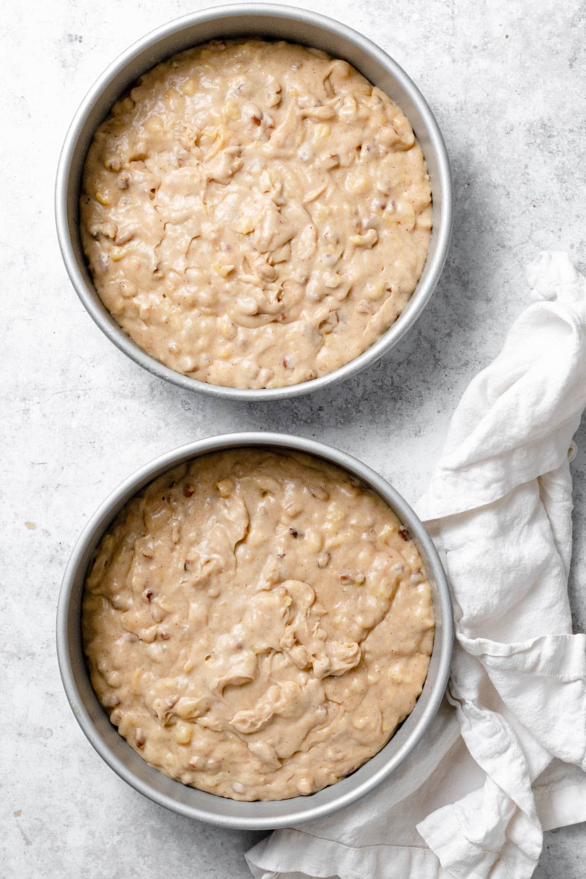 Hummingbird Cake Showing how to make hummingbird cake. Batter poured into two cake pans.