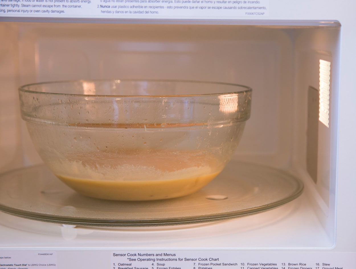 Microwave Caramels Heating butter, sugar, condensed milk mixture in glass mixing bowl in microwave to make caramels.