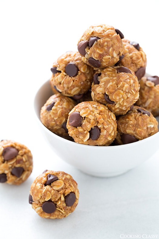 No Bake Energy Bites. The perfect on the go midday snack that couldn't be easier to make at home. | Energy Snacks | Energy Balls | #cookingclassy #bites #energy #snacks No Bake Energy Bites stacked in a white bowl