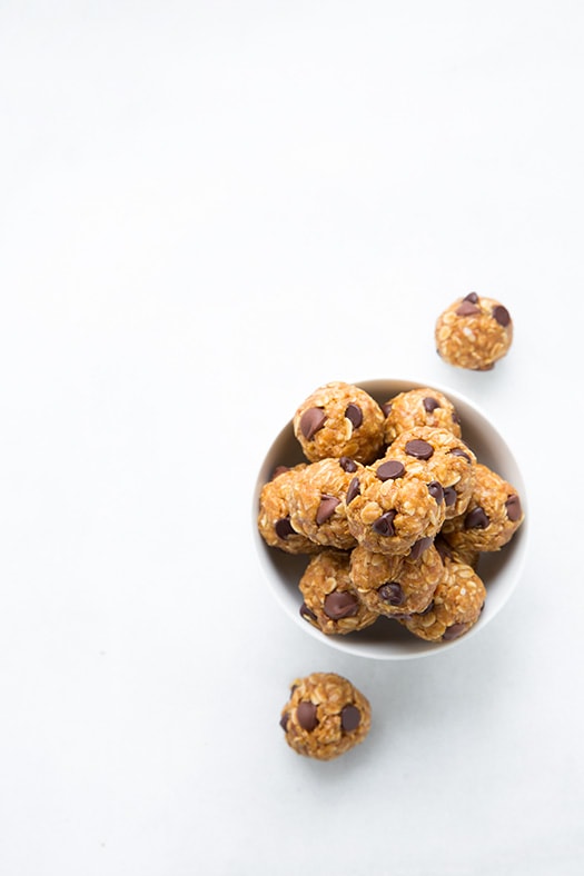 No Bake Energy Bites. The perfect on the go midday snack that couldn't be easier to make at home. | Energy Snacks | Energy Balls | #cookingclassy #bites #energy #snacks An overhead shot of No Bake Energy Bites in a white bowl