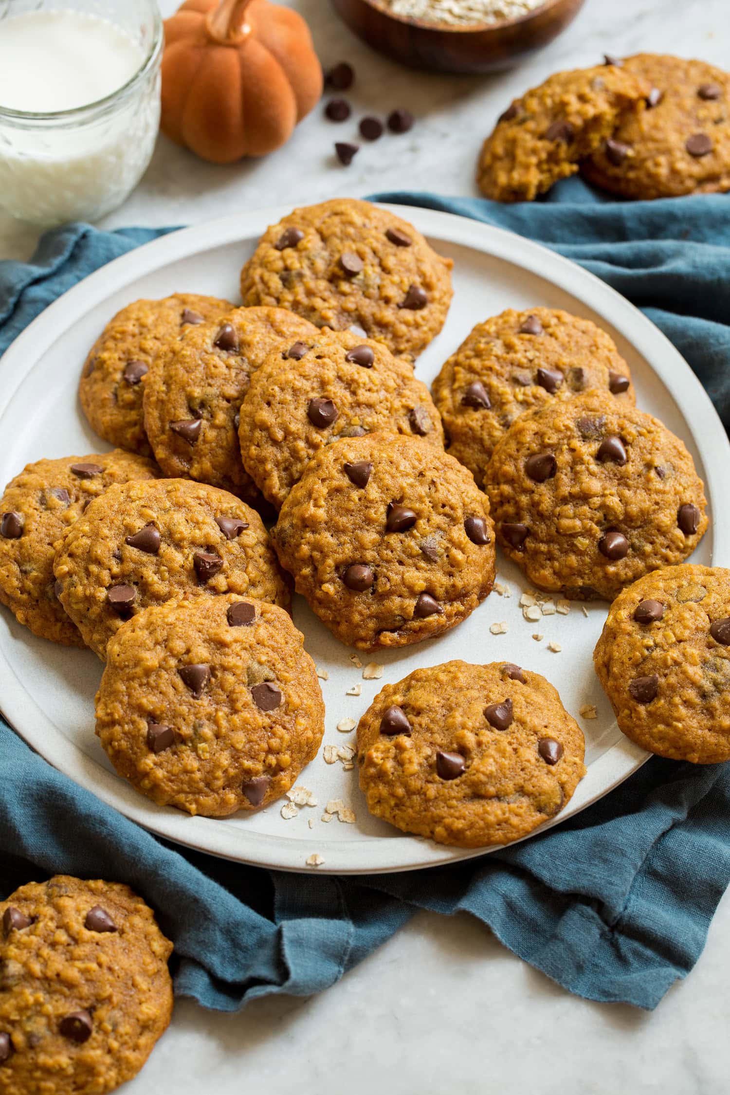 Pumpkin Oatmeal Chocolate Chip Cookies Pumpkin oatmeal cookies on a white serving plate.
