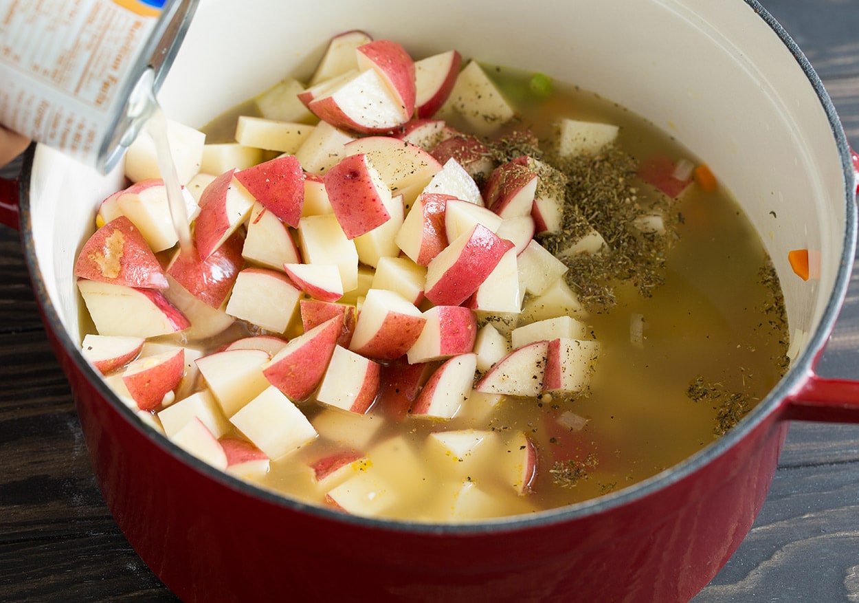 Creamy Ham Potato Corn Chowder adding potatoes broth herbs