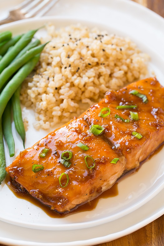 soy maple glazed salmon with rice and green beans on white plate