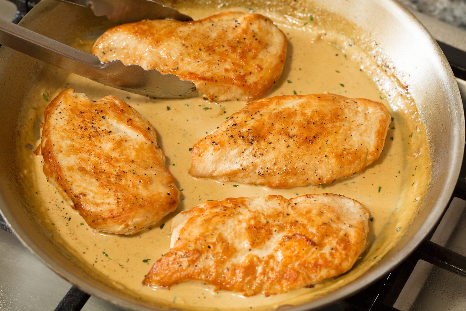 Creamy Dijon Mustard Chicken Seared chicken returned to sauce mixture in skillet.