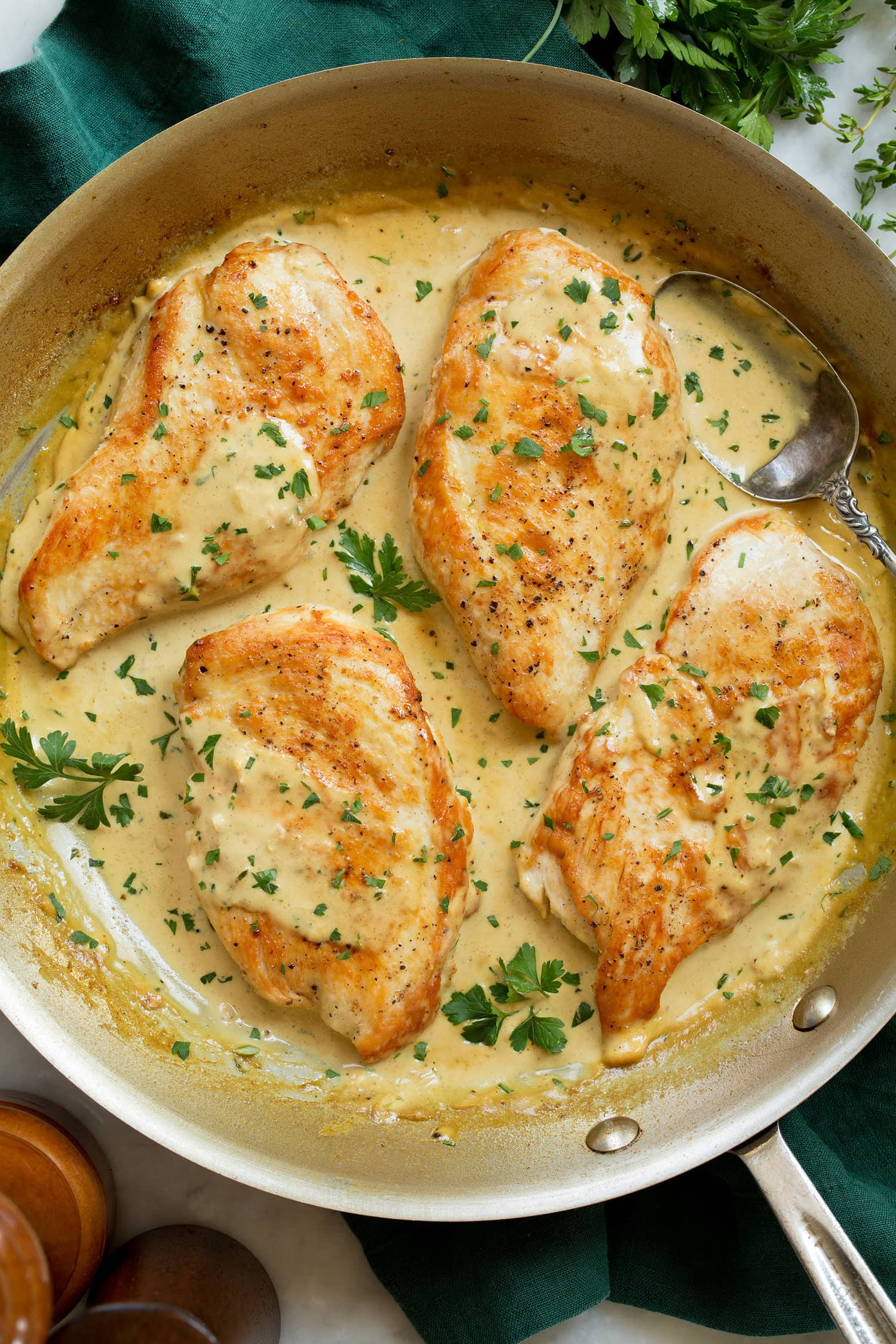Creamy Dijon Mustard Chicken Creamy dijon mustard chicken in a stainless still skillet.