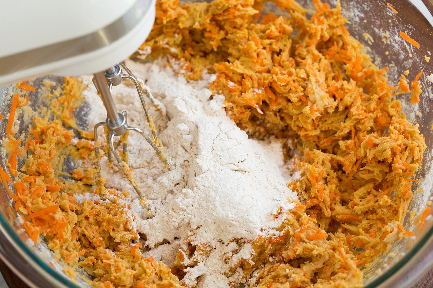 Second addition of flour added to cookie dough batter.