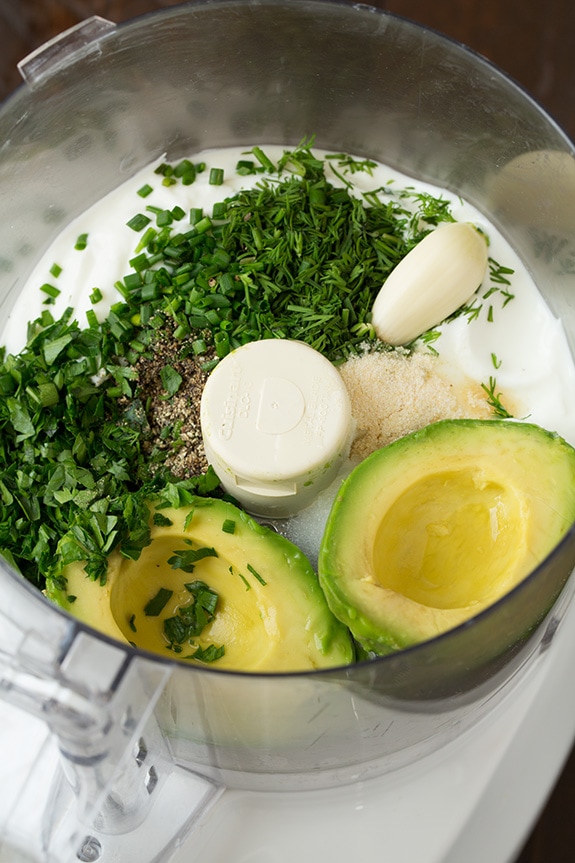 ingredients for avocado ranch dressing in bowl of food processor