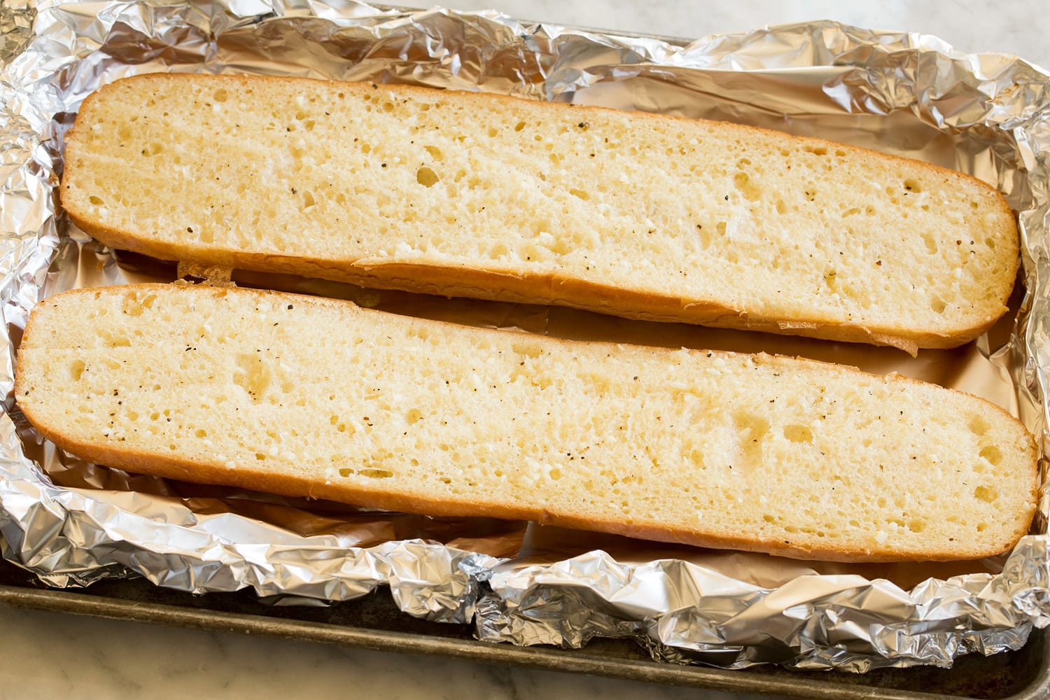 Cheesy Garlic Bread French bread halves toasted with butter.