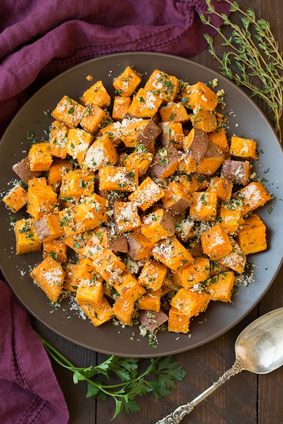 Savory Roasted Sweet Potatoes with Parmesan, Garlic & Herbs on a plate