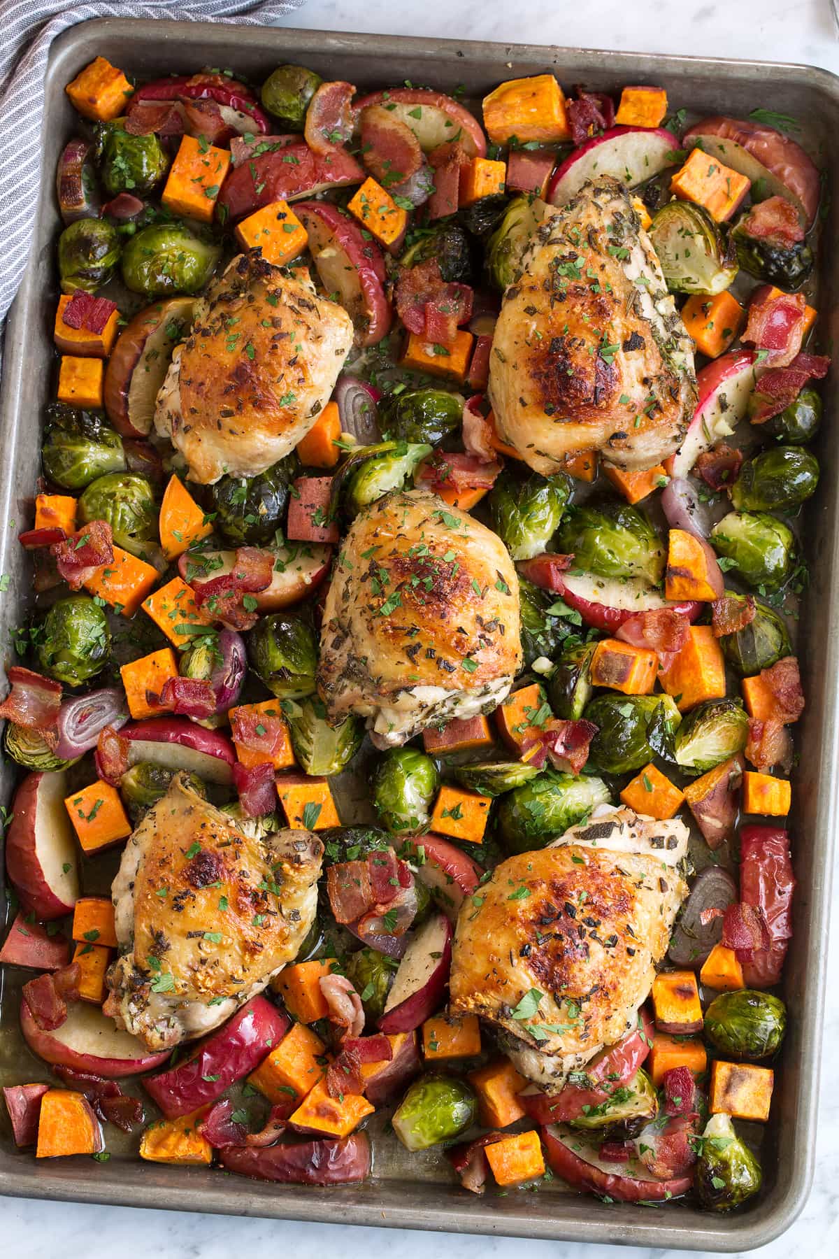 One Pan Autumn Chicken Dinner Sheet pan with roasted chicken and fall vegetables