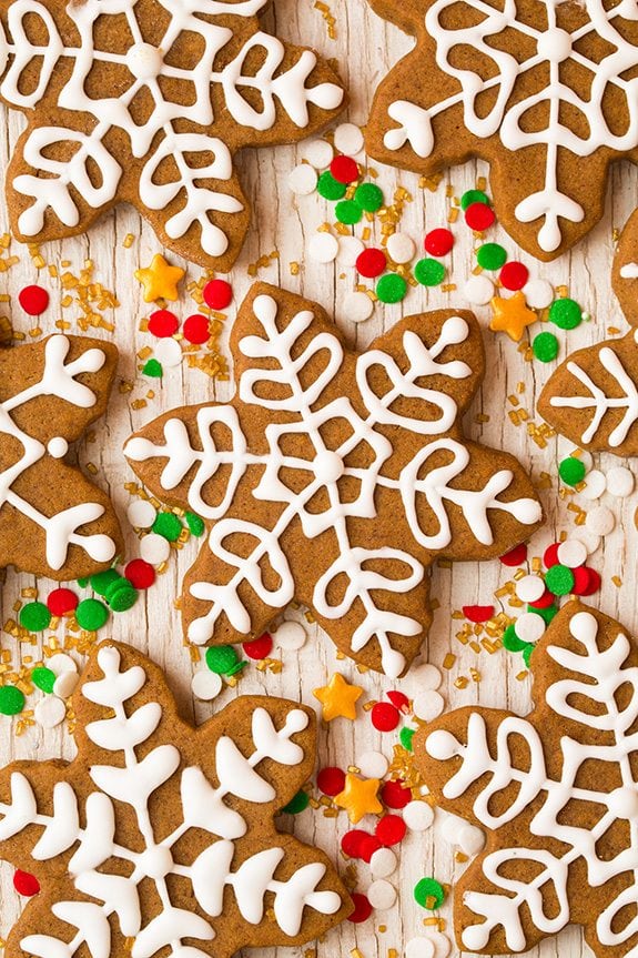 Gingerbread Cookies Gingerbread cookies sitting on a white wooden surface.