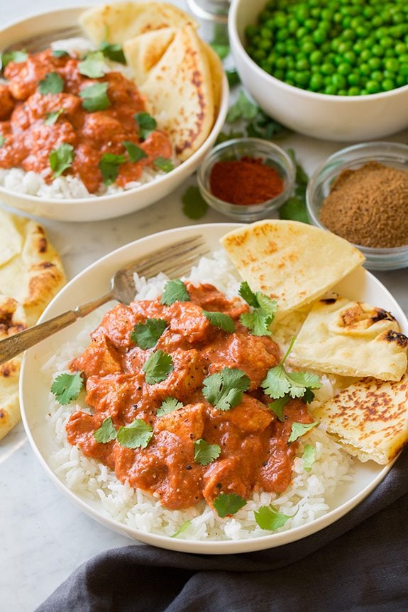 Chicken Tikka Masala Quick Chicken Tikka Masala two servings shown here in white bowls served over rice with naan