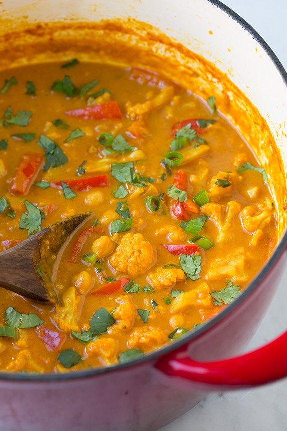 Red Vegetable Curry Red vegetable curry in a large red pot after simmering and finished.