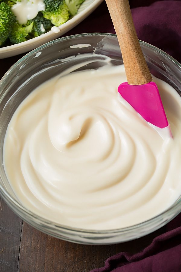 Broccoli and Cauliflower Salad will quickly become a staple recipes! It's always a crowd favorite, who knew people could love broccoli so much? | Broccoli Salad | Salad Side Dish | Salad With Bacon | #cookingclassy #broccoli #salad #bacon #cheese Dressing in a bowl for making a Broccoli and Cauliflower Salad