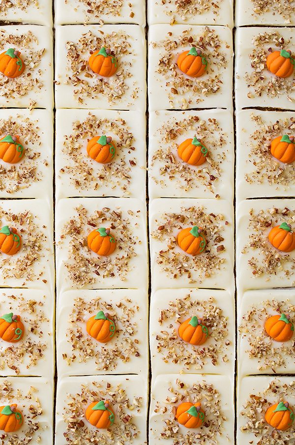 Pumpkin Sheet Cake with Cream Cheese Frosting Overhead image of 24 slices of pumpkin cake in a baking sheet.