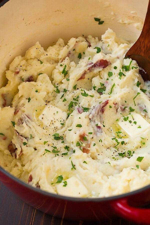 Roasted Garlic Mashed Potatoes Garlic mashed potatoes with butter in a pot.