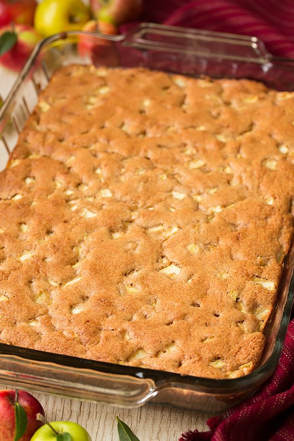 Warm Apple Cake with Brown Sugar Caramel Sauce A whole apple cake in a glass baking dish.