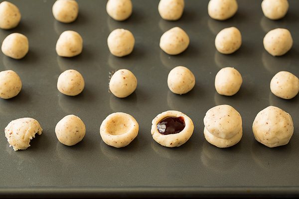 Raspberry Almond Snowball Cookies Raspberry Almond Snowball Cookies on a baking sheet before baking.