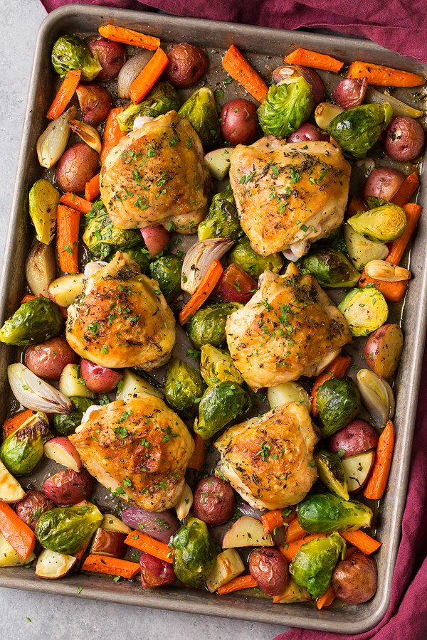 Sheet Pan Chicken and Veggies Roasted Chicken with Root Vegetables on baking sheet after baking.