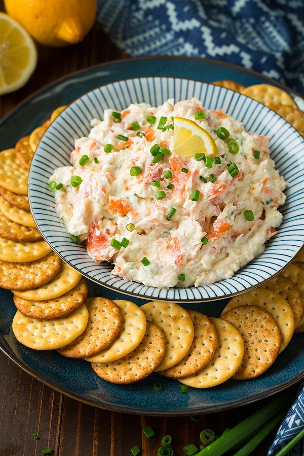 Smoked Salmon Dip Smoked Salmon Dip salmon dip in a serving bowl with a plate of crackers.