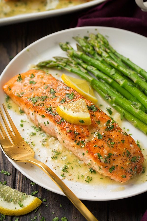 Skillet Seared Salmon with Garlic Lemon Butter Sauce. A delicious and easy meal that's perfect for weeknights. | Salmon Recipes | Fish Recipes | Weeknight Meals | #salmon #fish #cookingclassy Close up image of single salmon fillet after cooking.