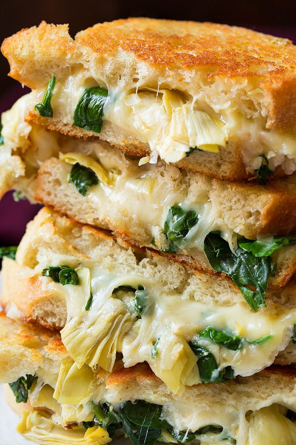 Spinach Artichoke Grilled Cheese Sandwich Close up image of grilled cheese sandwiches.