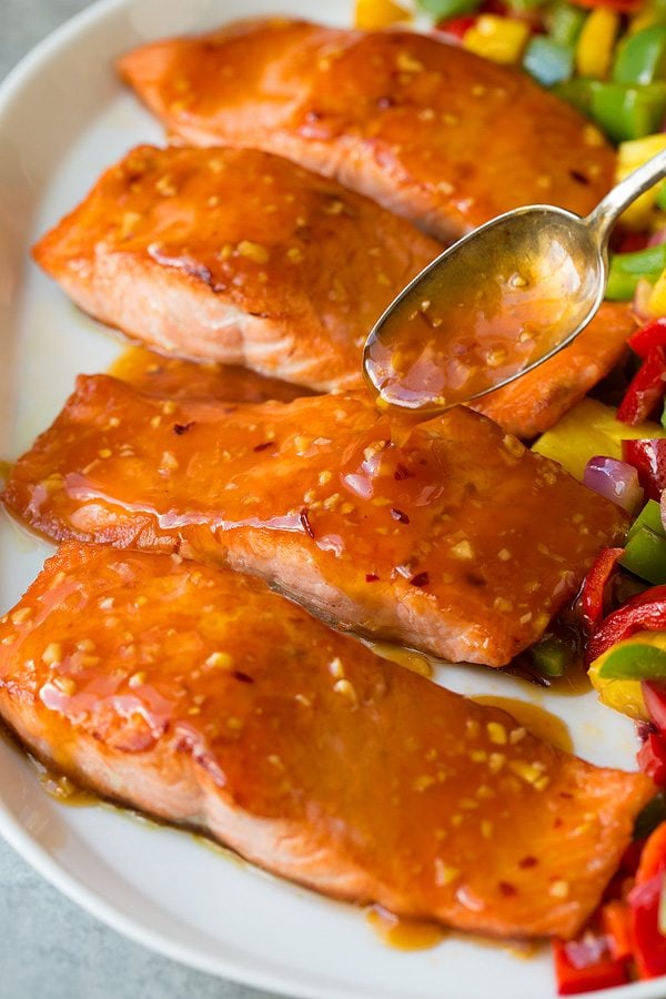 Sweet and Sour Salmon Adding sweet and sour sauce to salmon fillets