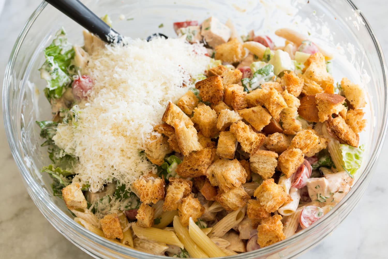 Chicken Caesar Pasta Salad Croutons and parmesan added to caesar pasta salad.