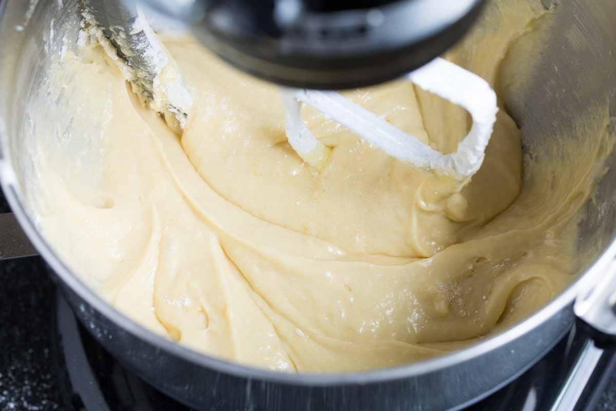 Tres Leches Cake - one of the BEST Mexican desserts! A sponge-type cake is soaked in a blend of rich milks, covered with whipped cream and dusted with cinnamon or served with strawberries. So good! #tresleches #cake #Mexicanrecipe #dessert Prepared tres leches cake batter in a mixing bowl.