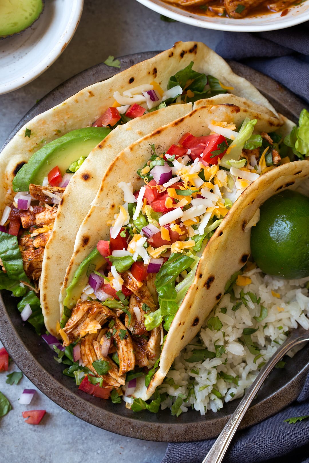 Salsa Chicken Tacos on plate with lime wedges