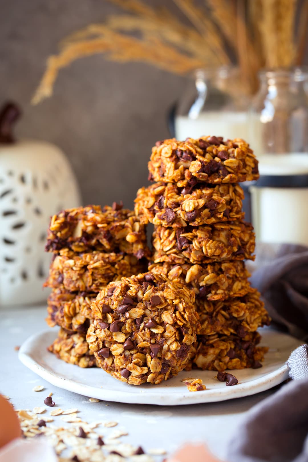 Two stacks of Pumpkin Oat Energy cookies on a plate.