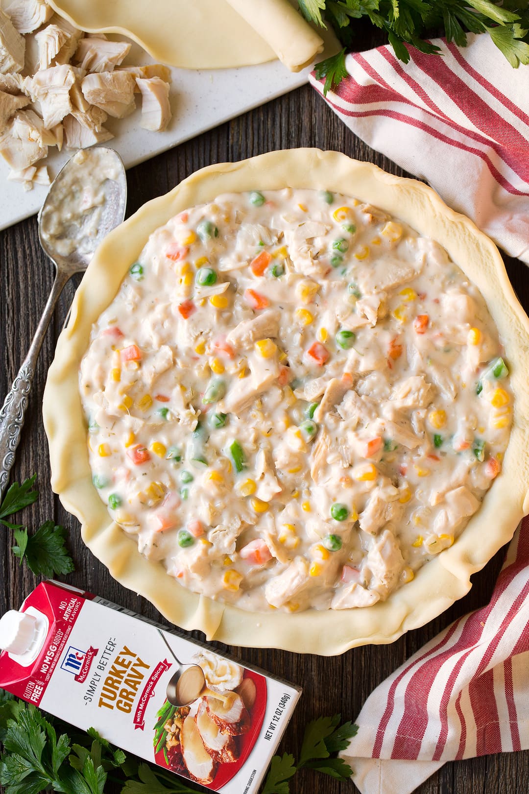 Chicken Pot Pie filling in pie crust before topping and baking.