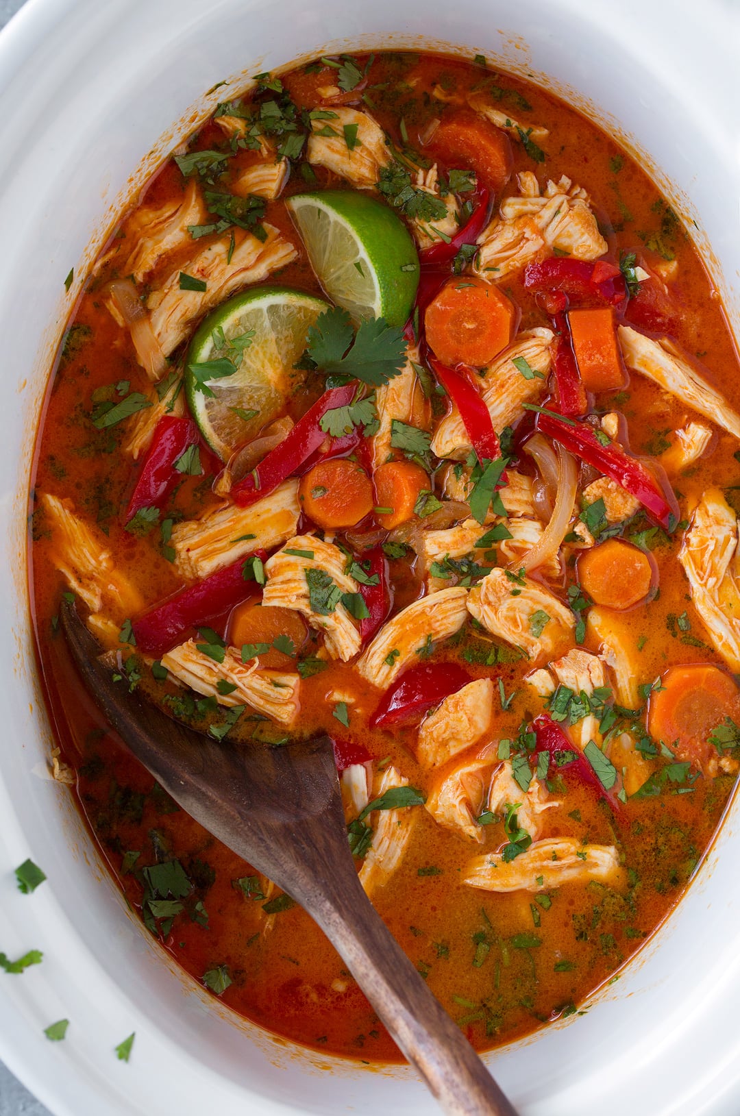 Thai Chicken Curry. A delicious and satisfying Thai chicken curry made in the slow cooker. There's minimal effort required to make this chicken curry and maximum flavor! Serve with rice. | Easy Chicken Curry | Slow Cooker Curry | #cookingclassy #curry #Thaifood #chicken An overhead shot of Slow Cooker Thai Chicken Curry in a slow cooker