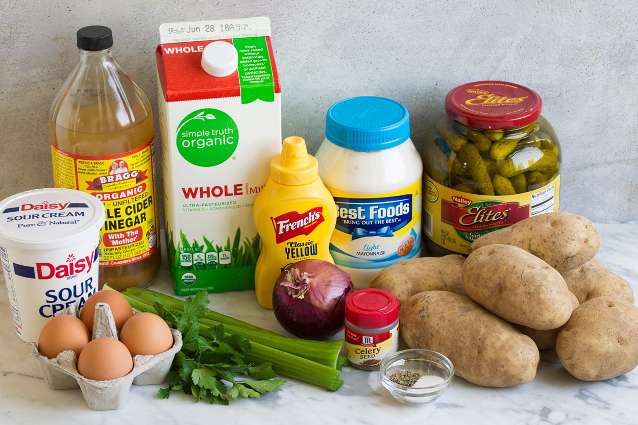 the best potato salad ingredients on a marble surface