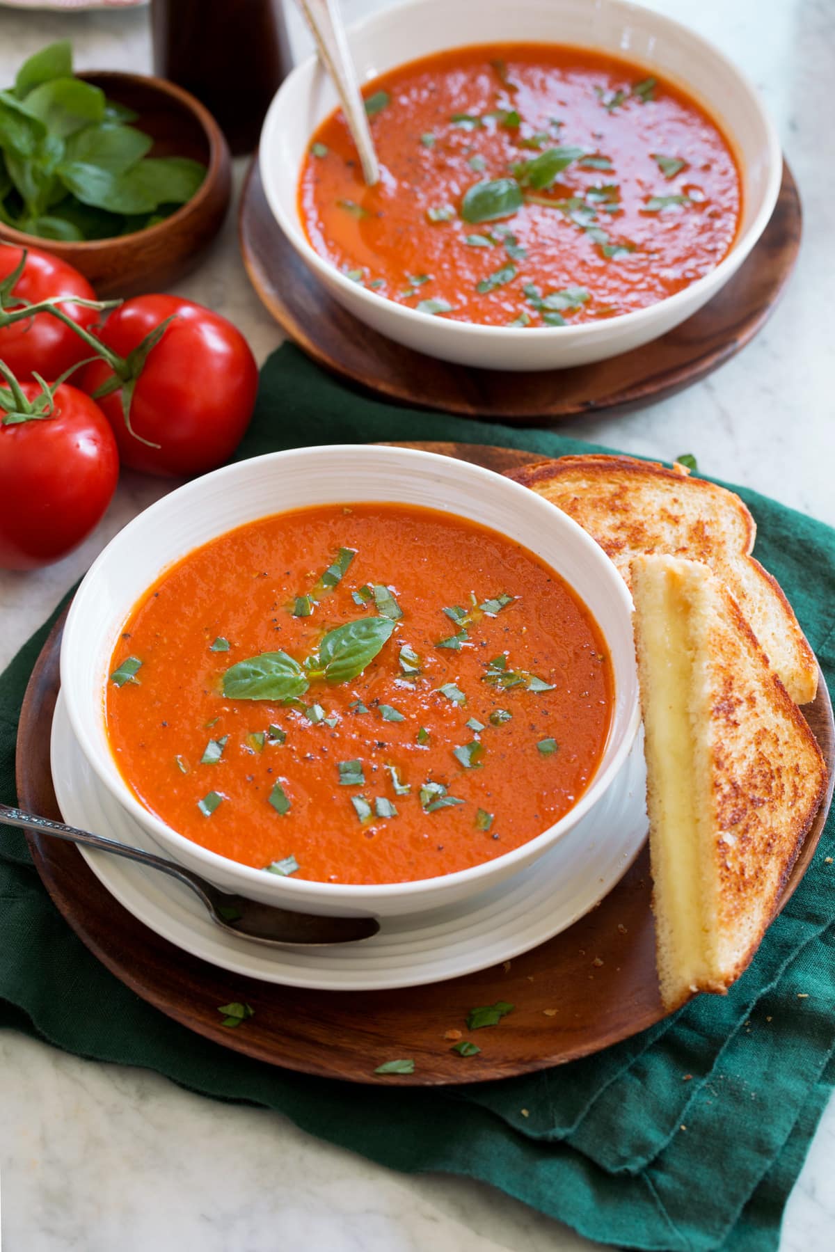 Roasted Tomato Basil Soup Two servings of tomato basil soup in serving bowls.