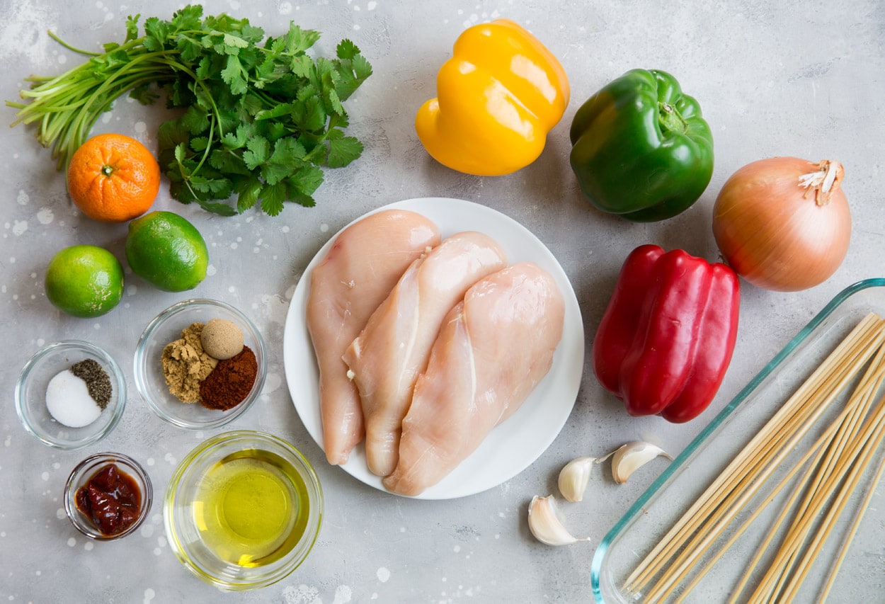 Chicken Fajita Kebabs ingredients chicken olive oil spices limes orange bell peppers onion garlic cilantro oil