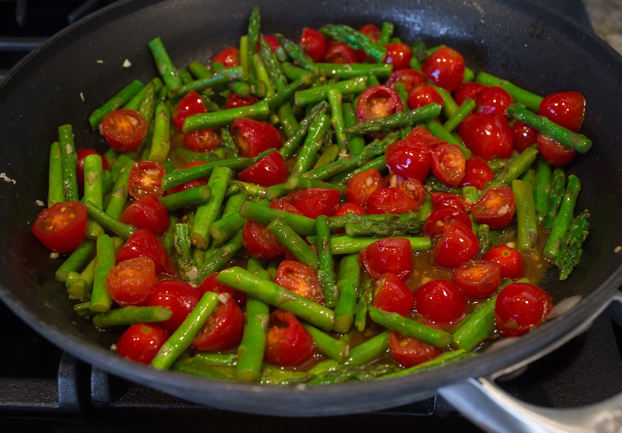 asparagus and tomatoes sauteed in butter and oil with garlic