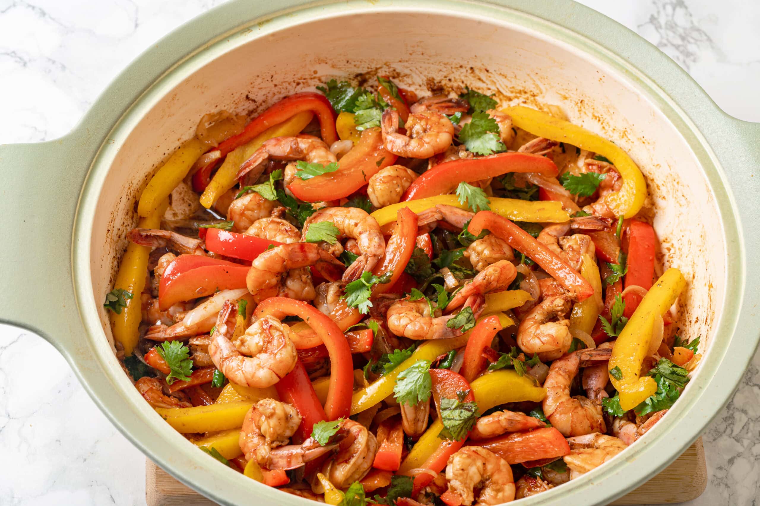 Shrimp Fajitas Sauteed shrimp and bell pepper mixture in a skillet.